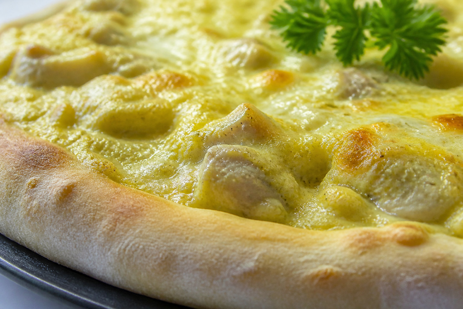 La recette pizza poulet curry : les bases pour un festin réussi
